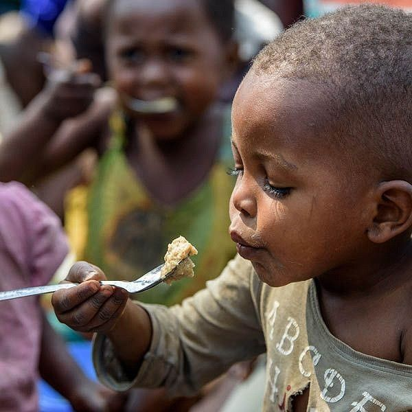 Young boy looking hopeful